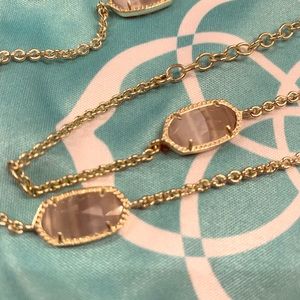 Long gold tone with smoky stone necklace